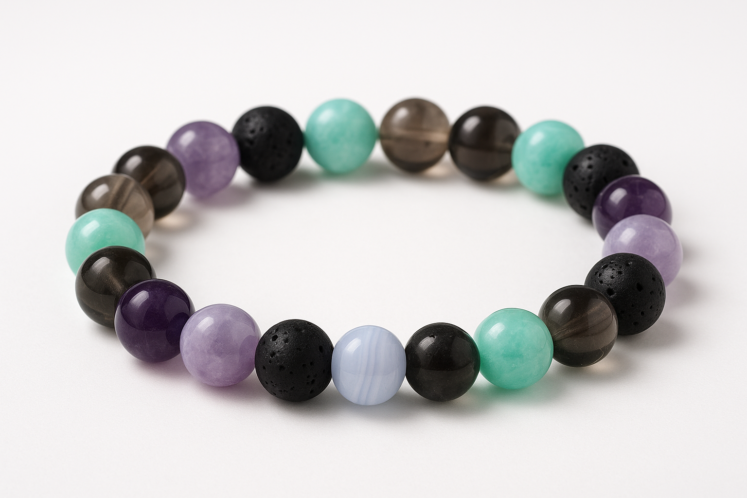 An 8mm crystal bracelet with Amethyst, Lepidolite, Blue Lace Agate, Black Lava , Amazonite, Smoky Quartz beads, arrange equally distributed no same crystal or color together make it aesthtic no blured